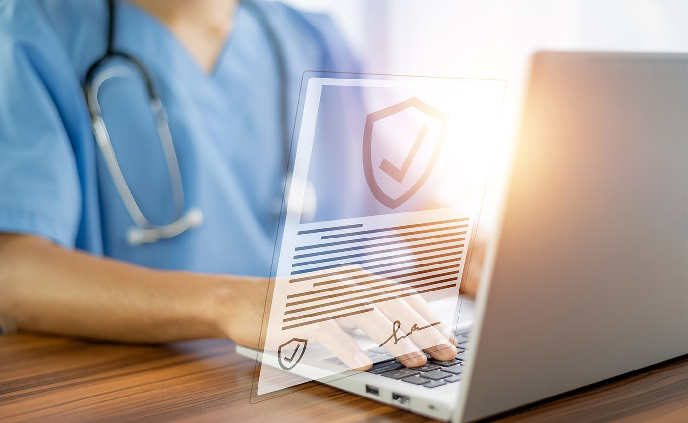 A physician working on the laptop